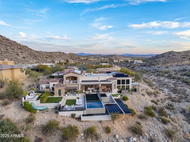 rear view of property with a mountain view