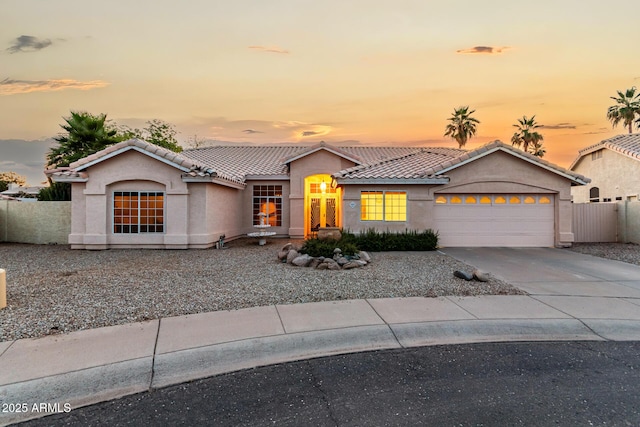 462 N Bedford Ct, Chandler, AZ 85225 - view of front of house featuring an attached garage, a tile roof, stucco siding, and driveway
