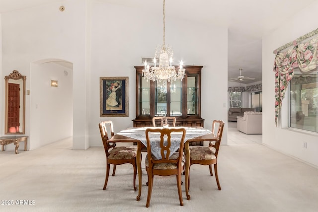 462 N Bedford Ct, Chandler, AZ 85225 - carpeted dining room with arched walkways, a chandelier, and ceiling fan