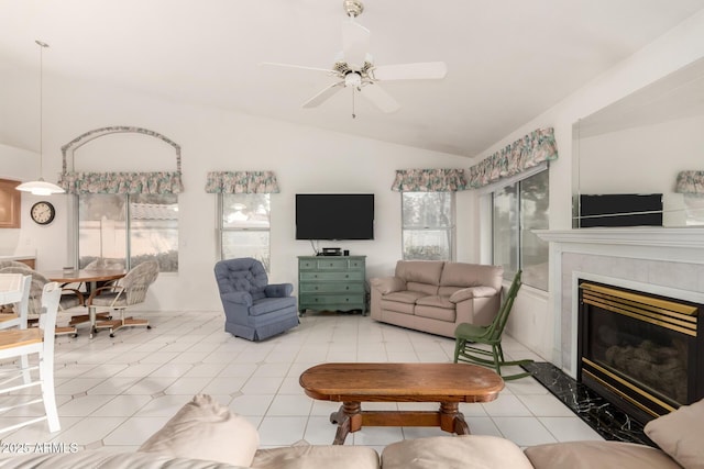 462 N Bedford Ct, Chandler, AZ 85225 - living area with vaulted ceiling, ceiling fan, a tiled fireplace, and light tile patterned floors