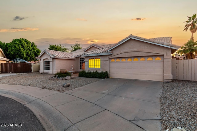 462 N Bedford Ct, Chandler, AZ 85225 - view of front of home featuring stucco siding, driveway, an attached garage, and a tile roof