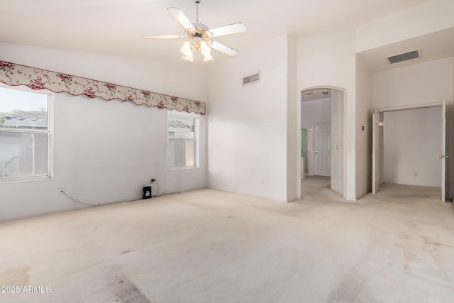 462 N Bedford Ct, Chandler, AZ 85225 - unfurnished bedroom featuring multiple windows, vaulted ceiling, carpet flooring, and arched walkways