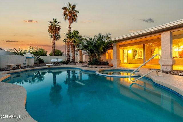 462 N Bedford Ct, Chandler, AZ 85225 - pool at dusk featuring a fenced backyard, a patio, and a pool with connected hot tub