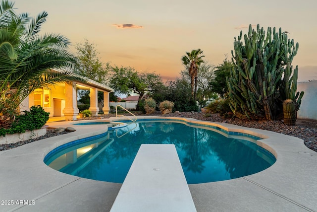 462 N Bedford Ct, Chandler, AZ 85225 - pool at dusk featuring an outdoor pool and a diving board