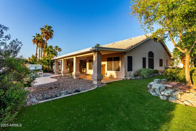 462 N Bedford Ct, Chandler, AZ 85225 - rear view of property featuring stucco siding, a yard, a patio, and a tiled roof