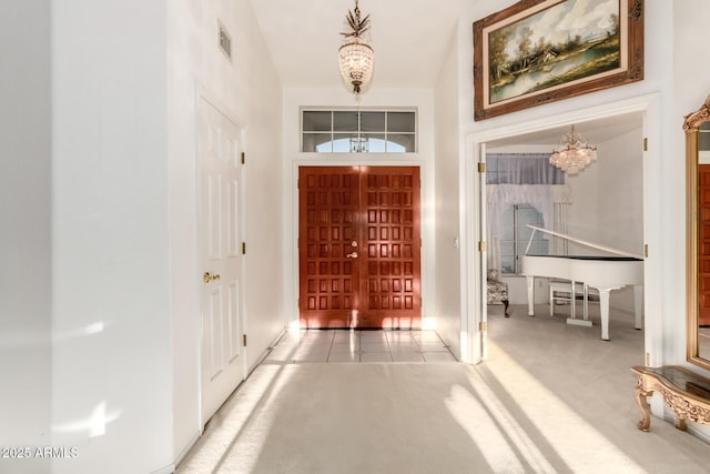 462 N Bedford Ct, Chandler, AZ 85225 - foyer with a chandelier, baseboards, carpet, and tile patterned floors