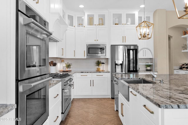 20151 E Via Del Palo St, Queen Creek, AZ 85142 - kitchen with stainless steel appliances, decorative backsplash, decorative light fixtures, a chandelier, and recessed lighting