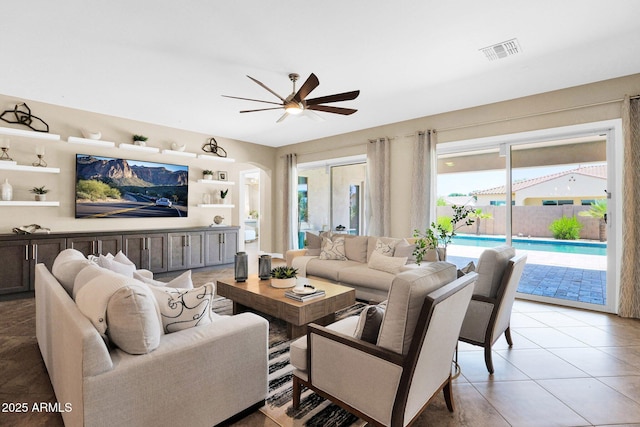 20151 E Via Del Palo St, Queen Creek, AZ 85142 - living room with a ceiling fan, arched walkways, and light tile patterned floors