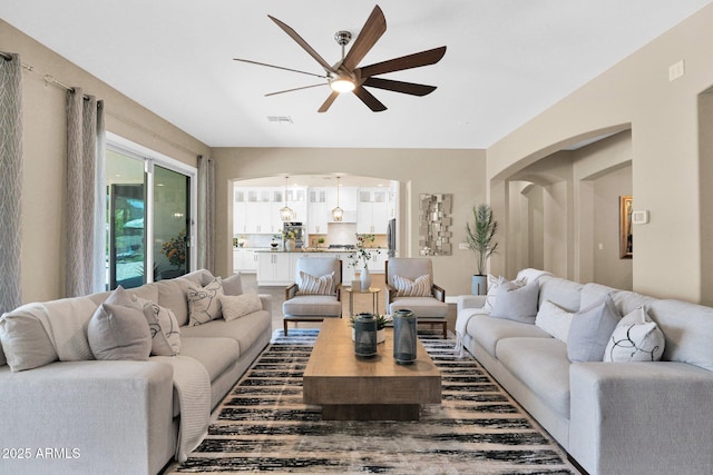 20151 E Via Del Palo St, Queen Creek, AZ 85142 - living room featuring ceiling fan and arched walkways