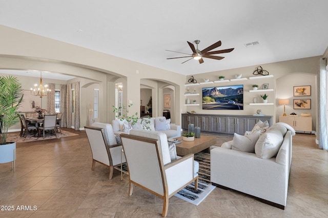 20151 E Via Del Palo St, Queen Creek, AZ 85142 - living area featuring arched walkways, ceiling fan, a chandelier, and light tile patterned floors