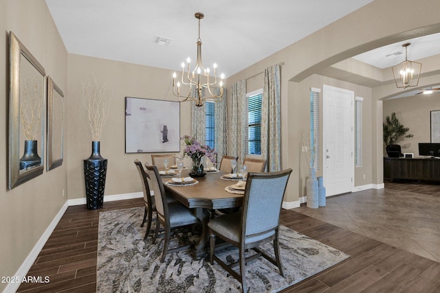 20151 E Via Del Palo St, Queen Creek, AZ 85142 - dining room with a chandelier, dark wood-style flooring, and arched walkways