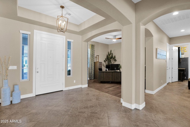 20151 E Via Del Palo St, Queen Creek, AZ 85142 - foyer entrance with arched walkways, a chandelier, and a raised ceiling