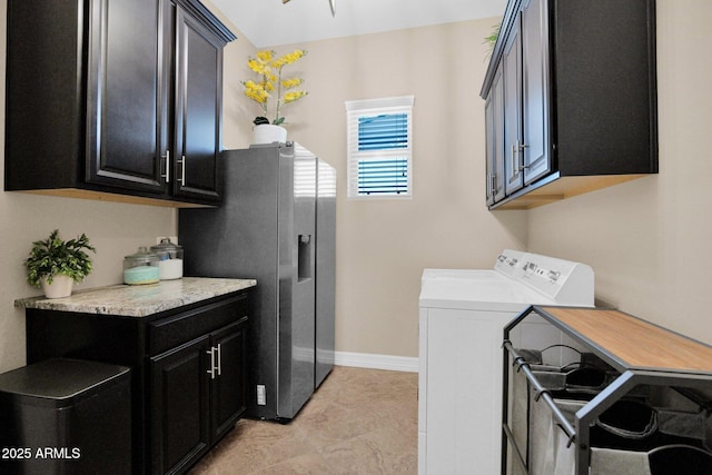 20151 E Via Del Palo St, Queen Creek, AZ 85142 - laundry area featuring washing machine and dryer, cabinet space, and light tile patterned floors