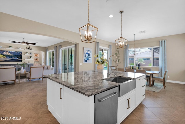 20151 E Via Del Palo St, Queen Creek, AZ 85142 - kitchen featuring dishwasher, a chandelier, arched walkways, open floor plan, and dark stone countertops