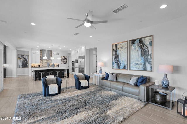 living room featuring ceiling fan