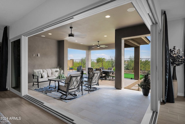 view of patio with ceiling fan and an outdoor hangout area