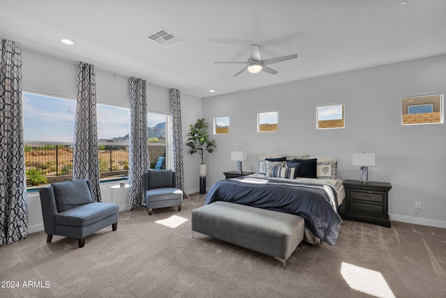 bedroom with ceiling fan and carpet floors