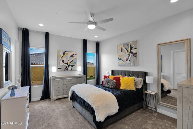 bedroom with ceiling fan and carpet floors