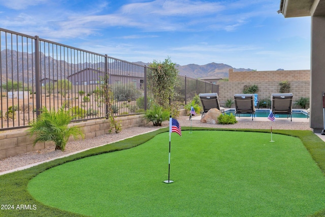 view of community featuring a mountain view and a pool