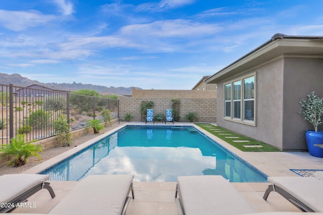 view of swimming pool featuring a mountain view