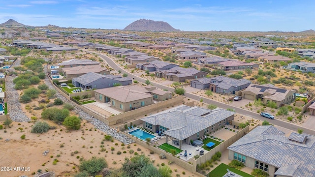 birds eye view of property featuring a mountain view