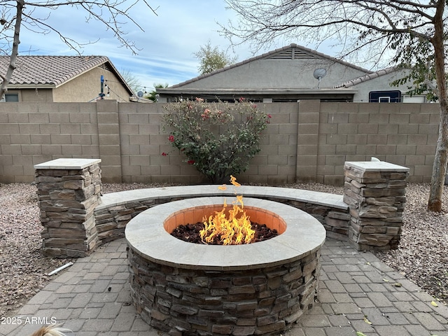 view of patio with a fire pit