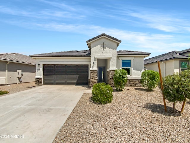 prairie-style home featuring a garage