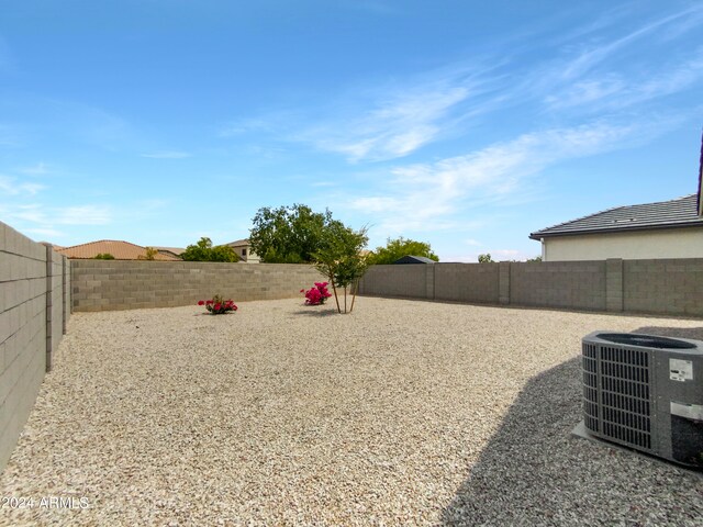 view of yard with central AC unit