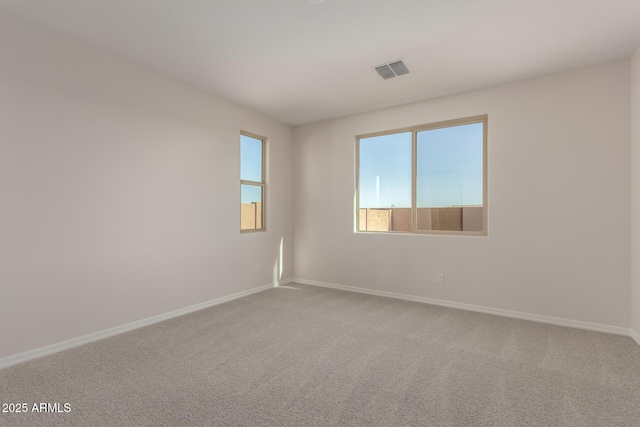 unfurnished room with carpet floors