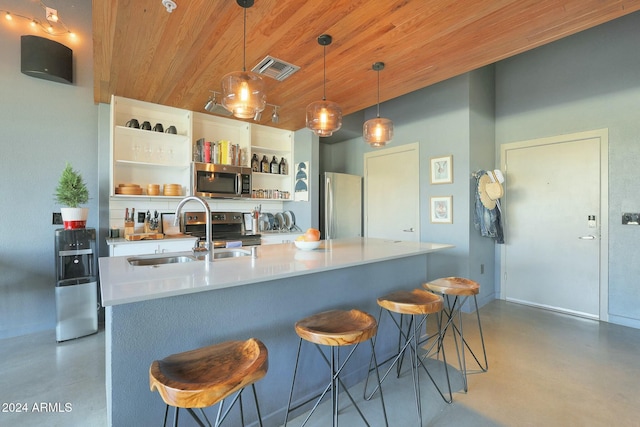 kitchen with sink, a breakfast bar area, decorative light fixtures, wood ceiling, and stainless steel appliances