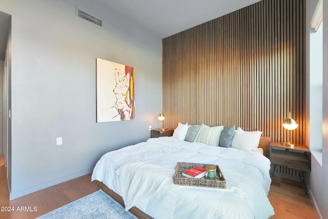 bedroom featuring wood-type flooring