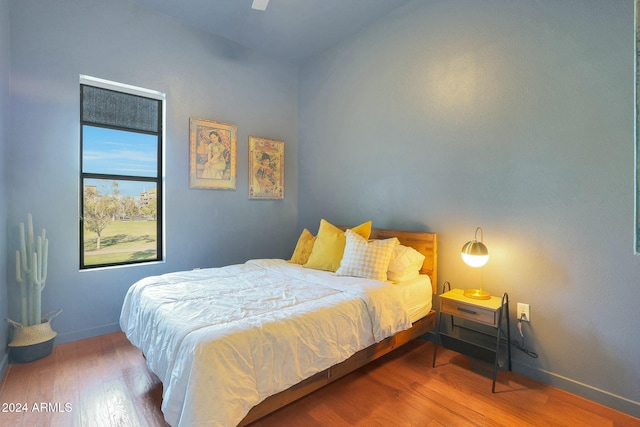 bedroom featuring hardwood / wood-style flooring and ceiling fan