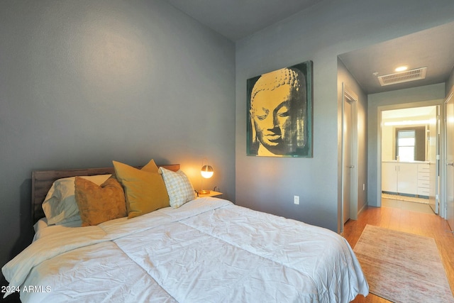 bedroom featuring light hardwood / wood-style floors