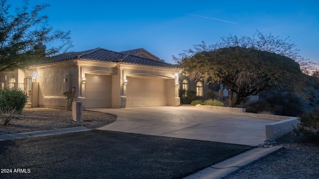 view of front of property with a garage