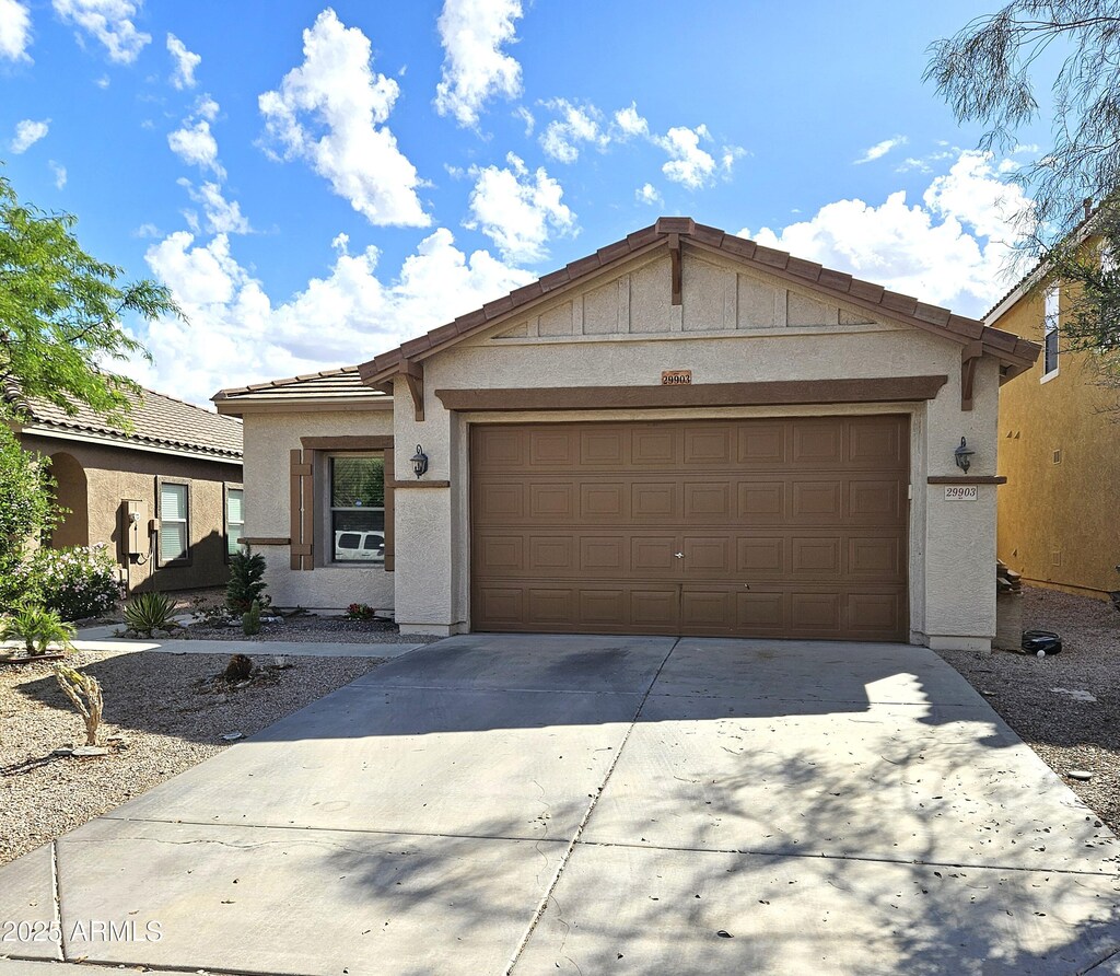 29903 N Desert Angel Dr, San Tan Valley, AZ 85143 - ranch-style house with a tile roof, a garage, driveway, and stucco siding