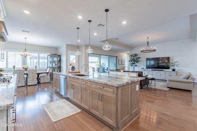 kitchen featuring stainless steel appliances, wood-type flooring, and a large island