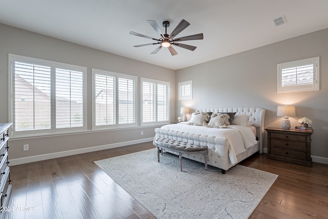 bedroom featuring ceiling fan and dark wood-type flooring