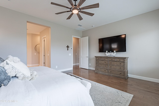 bedroom with ceiling fan and dark hardwood / wood-style floors