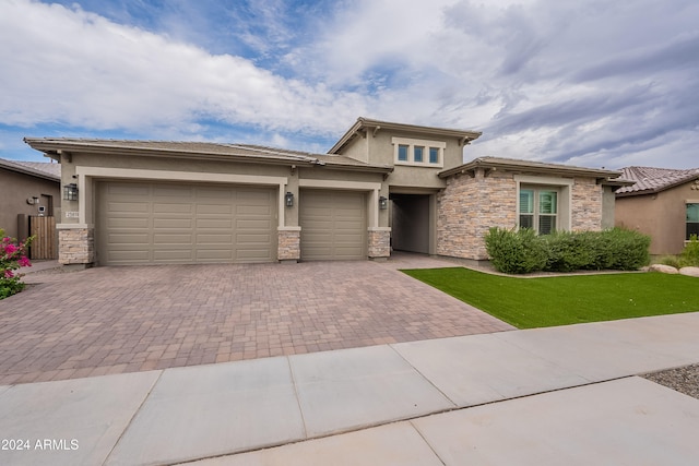 prairie-style house featuring a garage