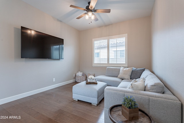 living room featuring ceiling fan and wood-type flooring