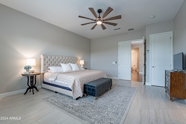 bedroom featuring ceiling fan and light hardwood / wood-style floors