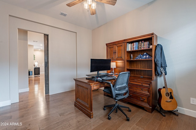 office with hardwood / wood-style floors and ceiling fan