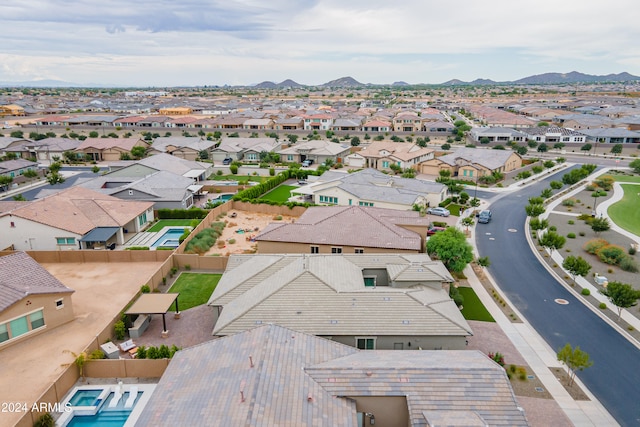 birds eye view of property with a mountain view