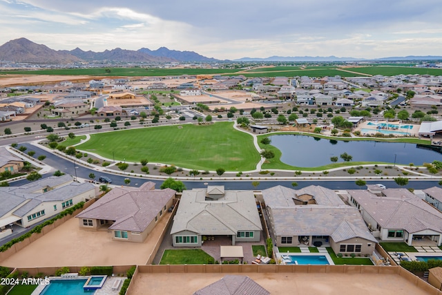 aerial view featuring a water and mountain view