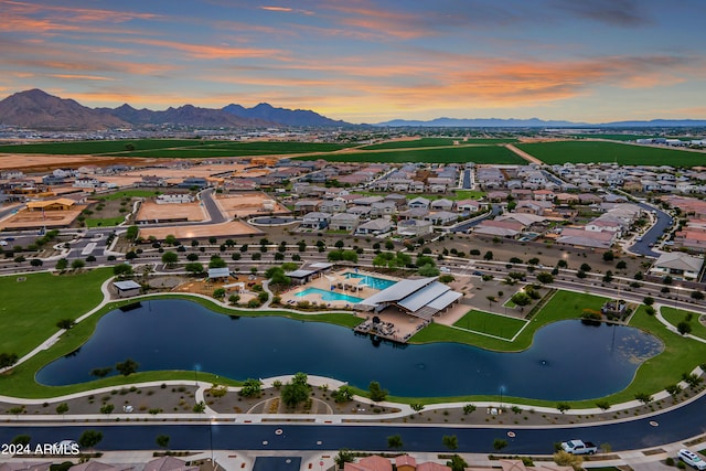 aerial view at dusk with a water and mountain view