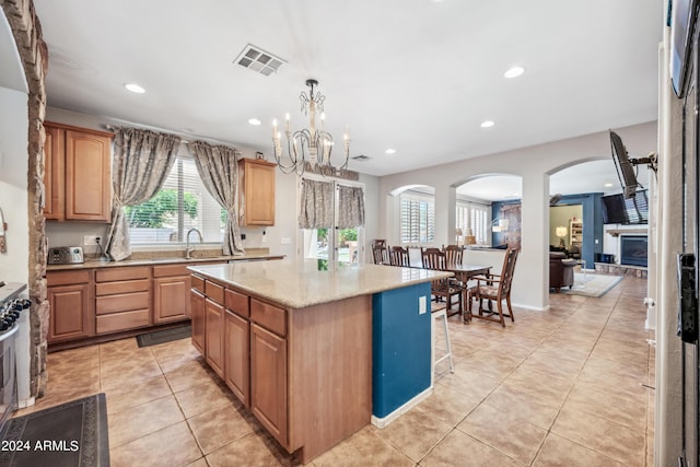kitchen featuring arched walkways, recessed lighting, light tile patterned flooring, and visible vents