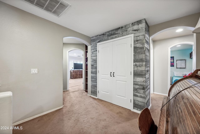 bedroom featuring a closet, baseboards, carpet flooring, and visible vents