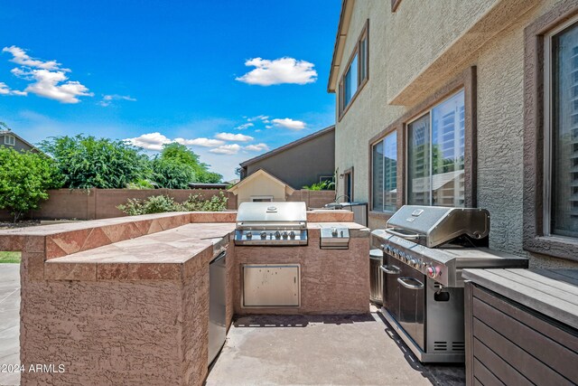 view of patio featuring a fenced backyard, area for grilling, and a grill