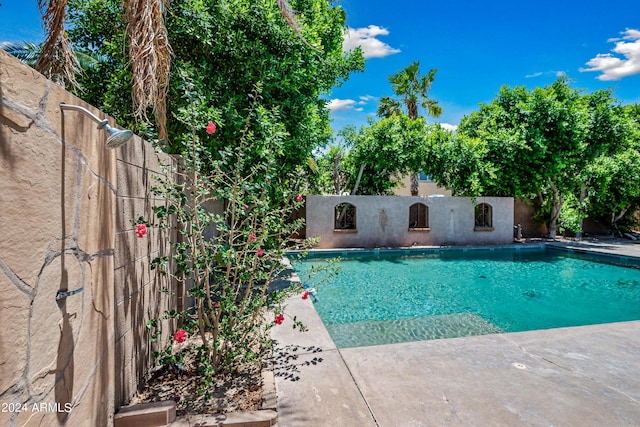 view of swimming pool featuring a fenced in pool and a fenced backyard