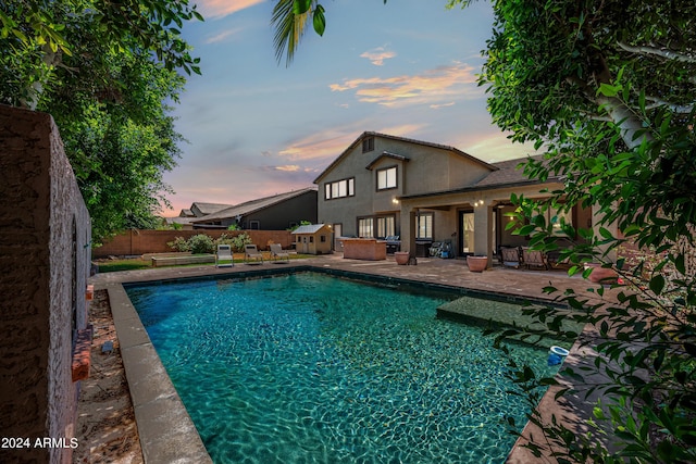 view of pool with a fenced in pool, a fenced backyard, and a patio area